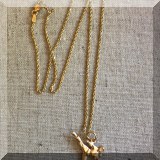J18. 14K Gold chain with karate pendant. - $225